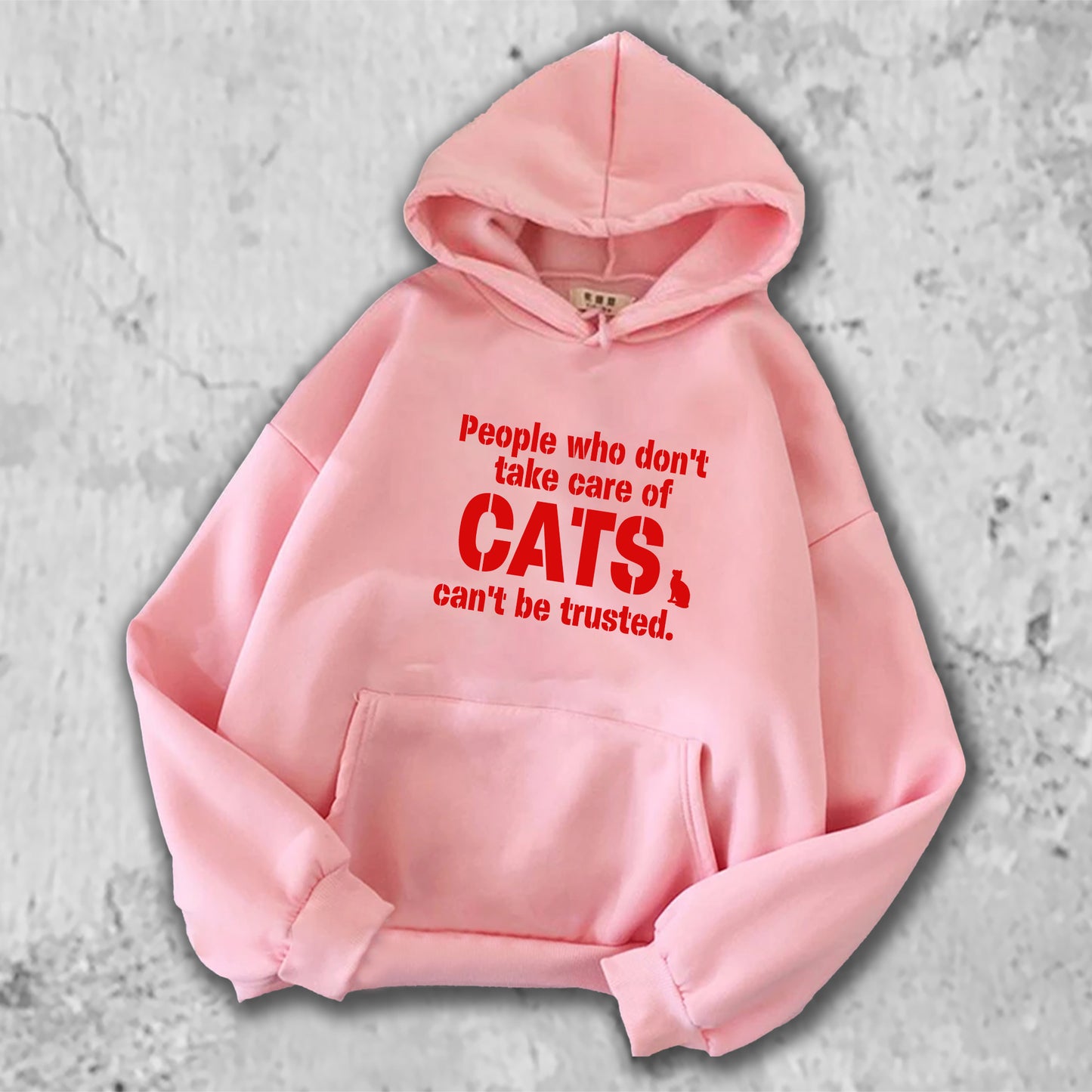 「猫を大事に扱わない人を私は信用しない。」がプリントされたパーカー  ピンク